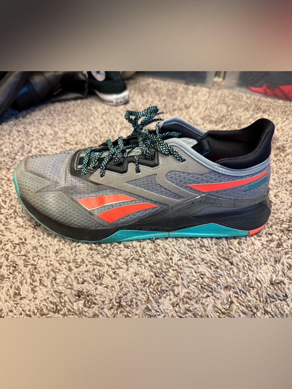 Reebok Men’s Gray Athletic Shoes with Teal and Orange Accents
